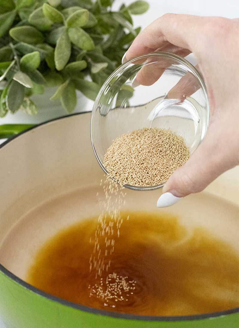 dashi stock powder is poured into a large pot