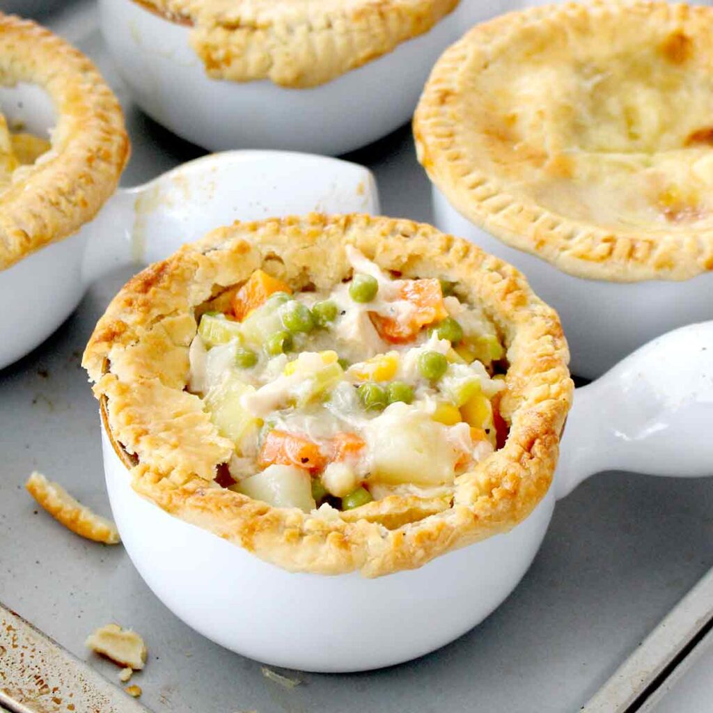 homemade chicken pot pies on a baking sheet