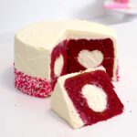 a red velvet cake with one slice