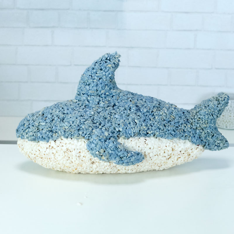 A shark made from rice krispie treats on a white table