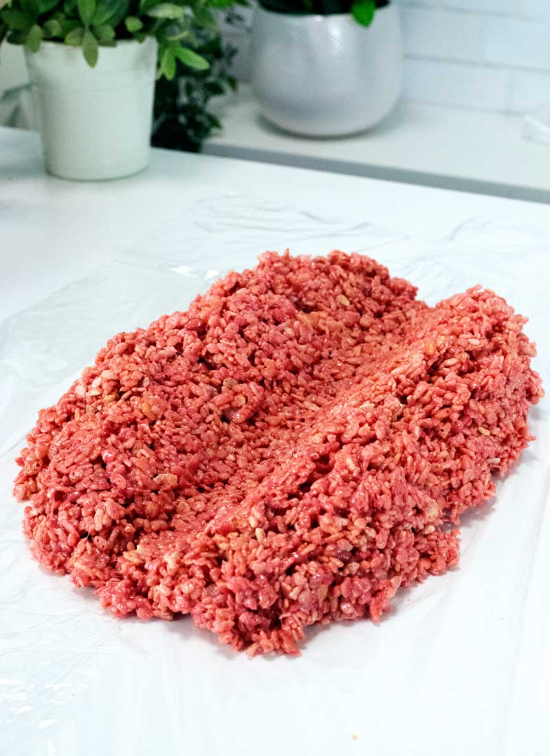 A red rice krispie treat on a white table
