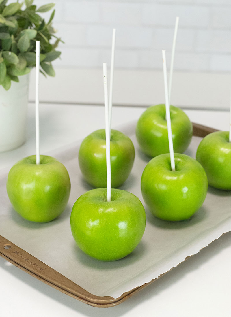 insert sticks into apples