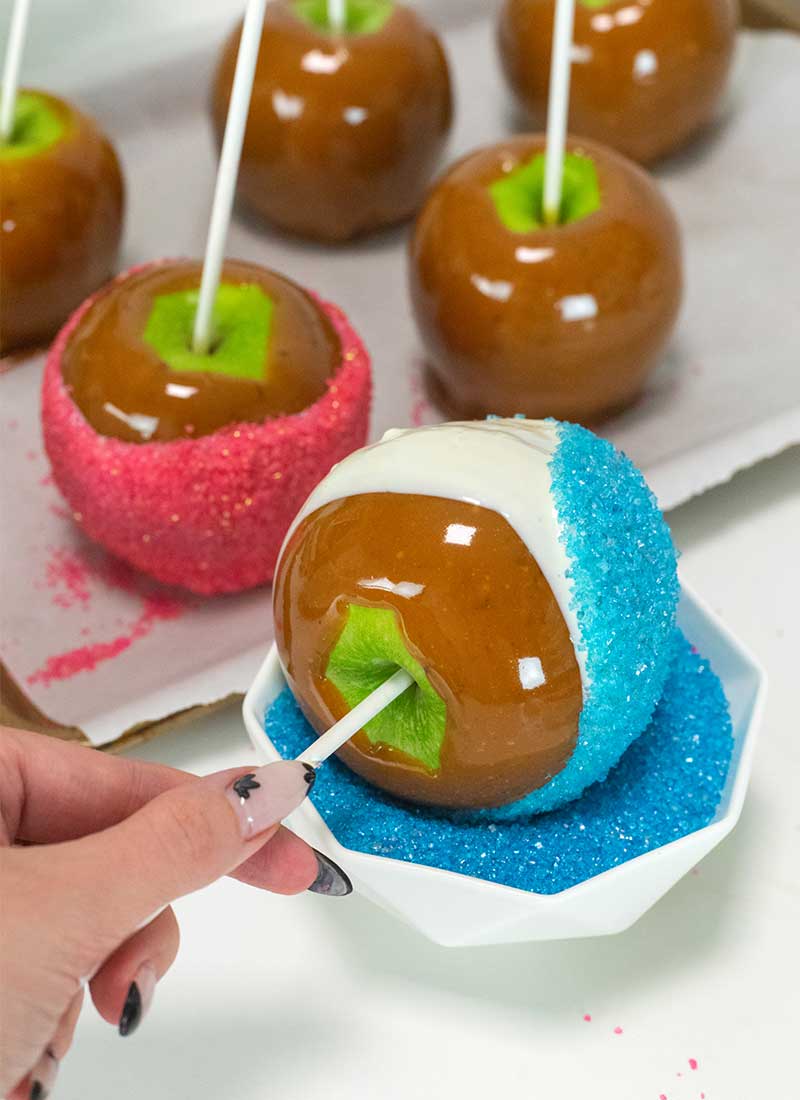 roll apples in colored sugar