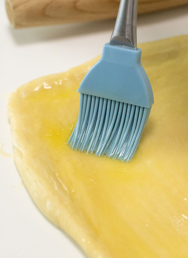 brush dough with butter