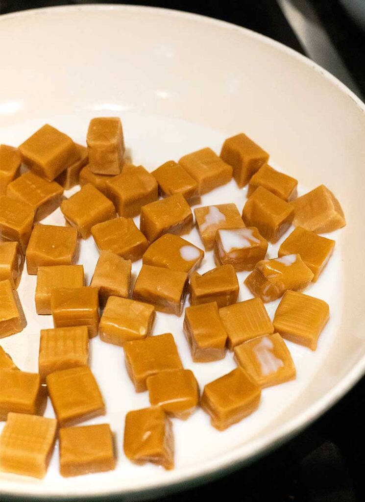 combine caramels and milk in pan