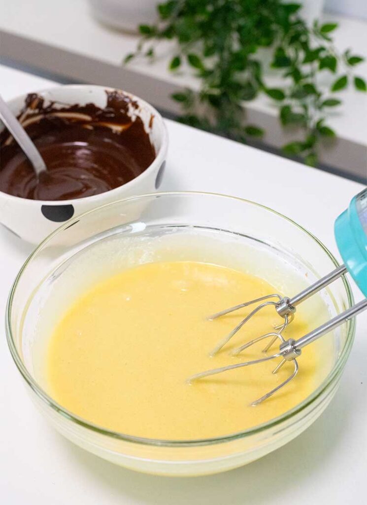 Eggs and vanilla have been added to the sugar and butter mixture and mixed well.