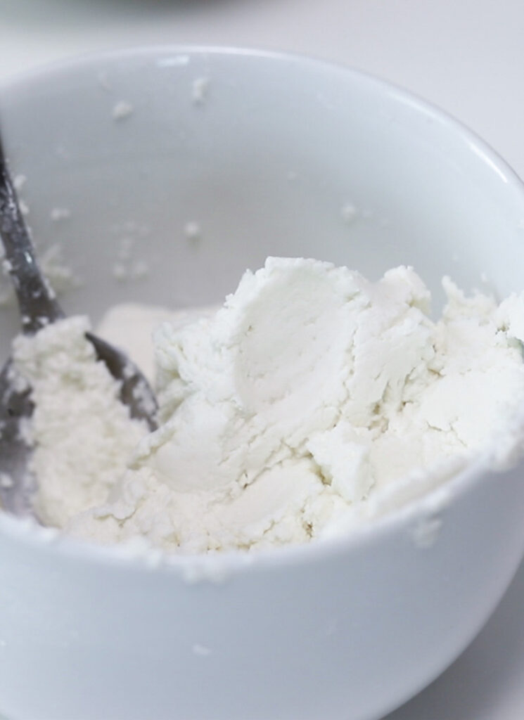 The rice flour has been mixed with water to create a dough.